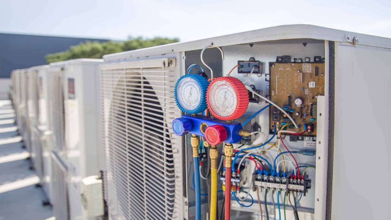 Close-up inspection of a heating and cooling equipment cabinet